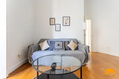 a living room with a couch and a glass table at Sagasta 1750 by Cadiz Time in Cádiz