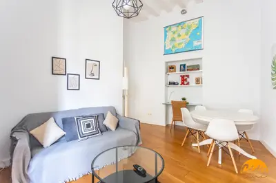 a living room with a couch and a table at Sagasta 1750 by Cadiz Time in Cádiz