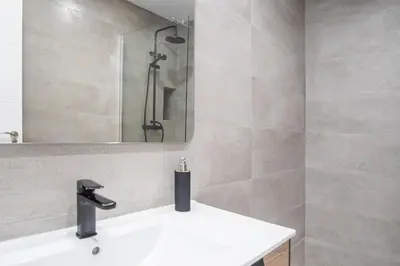 a bathroom with a sink and a shower at Nuevo Mirandilla Apartment - Cadiz Beach in Cádiz