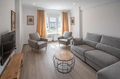 a living room with a couch and two chairs at Nuevo Mirandilla Apartment - Cadiz Beach in Cádiz