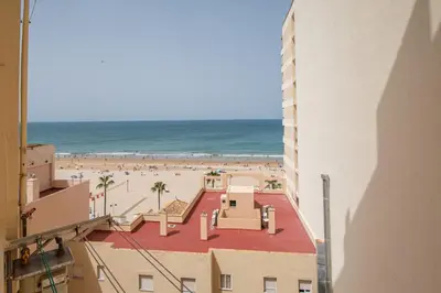 a view of the beach from a building at Nuevo Mirandilla Apartment - Cadiz Beach in Cádiz