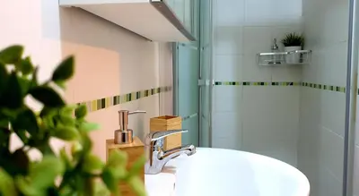a bathroom with a sink and a shower at Sherryflat Estudio- Parking, in Jerez de la Frontera