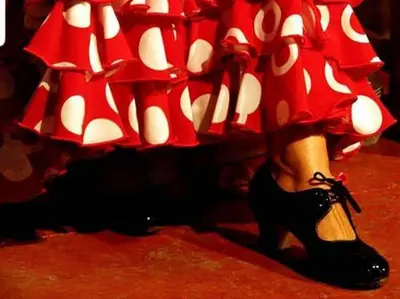 a woman in a red dress and black heels at Sherryflat Estudio- Parking, in Jerez de la Frontera