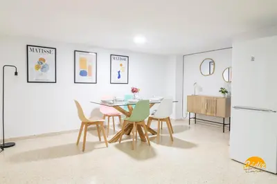 a kitchen and dining room with a table and chairs at Gallery Home by LiveWork in Cádiz