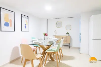 a dining room with a table and chairs at Gallery Home by LiveWork in Cádiz