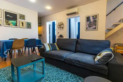 a living room with a couch and a table at SH La Casa del Capitán. Cerca de la catedral. in Cádiz