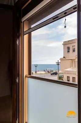 a window with a view of the ocean at Casa Capuchinos - FREE PARKING by Cadiz Time in Cádiz