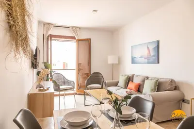 a living room with a couch and a table at Casa Capuchinos - FREE PARKING by Cadiz Time in Cádiz