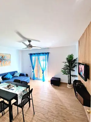 a living room with a couch and a table at Precioso apartamento en el corazón histórico in El Puerto de Santa María