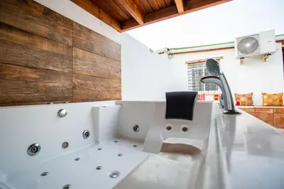 a bathroom with a sink and a faucet at Villa Tokio con jacuzzi y piscina privada in Chiclana de la Frontera