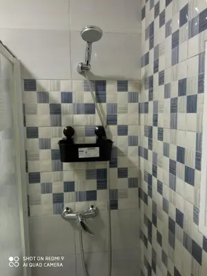 a shower with a shower head in a bathroom at Casa La Maravilla in Jerez de la Frontera