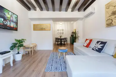 a living room with a white couch and a table at TACITA Family Home by Cadiz4Rentals in Cádiz