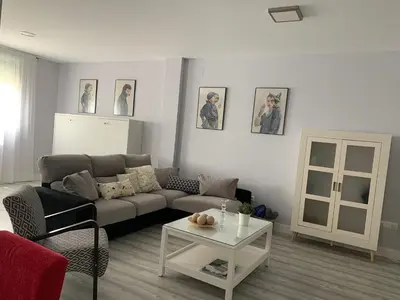 a living room with a couch and a table at LOFT CON ENCANTO in Arcos de la Frontera