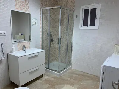 a bathroom with a shower with a sink and a toilet at LOFT CON ENCANTO in Arcos de la Frontera