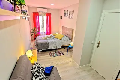 a small room with a bed and a couch at Plaza Noria Apartments with Balconies in El Puerto de Santa María