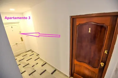 a room with a door and a arrow pointing to a room at Plaza Noria Apartments with Balconies in El Puerto de Santa María