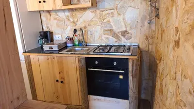 a kitchen with a stove and a sink at Casa Xeneize Punta Candor in Cádiz