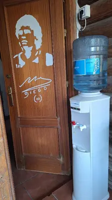 a door with a decal of a man on it at Casa Xeneize Punta Candor in Cádiz