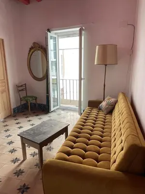 a living room with a couch and a table at Apartamentos la Selva - Rafael de la Viesca in Cádiz