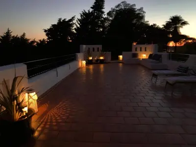 a night view of a patio with lights at Studio La Maravilla 1001 Nacht, Playa La Barrosa in Chiclana de la Frontera