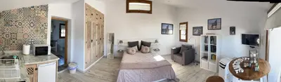 a bedroom with a bed in the middle of a room at Studio La Maravilla 1001 Nacht, Playa La Barrosa in Chiclana de la Frontera