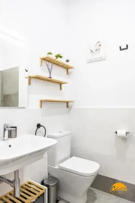 a bathroom with a toilet and a sink at El Arco del Fotografo by Cadiz Time in Cádiz