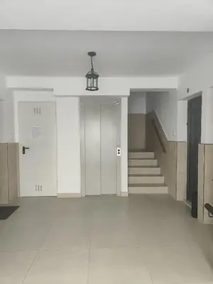 an empty hallway with stairs and a stair case at Apartamento Las Dunas in El Puerto de Santa María