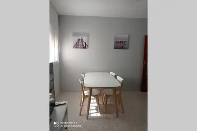 a dining room table and chairs in a room at Apartamento cabañiles wifi in Jerez de la Frontera