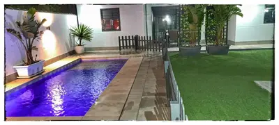 a swimming pool in the middle of a yard at Sirocco in Chiclana de la Frontera