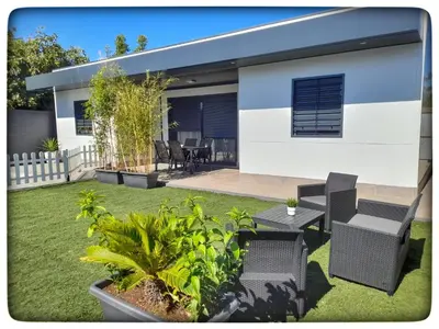 a house with a yard with chairs and a table at Sirocco in Chiclana de la Frontera
