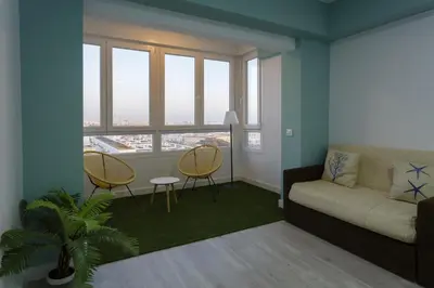 a living room with a couch and two chairs at ATLANTICO Family Home by Cadiz4Rentals in Cádiz