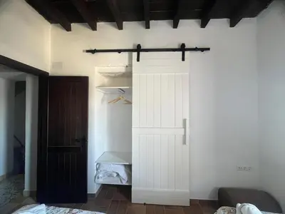 a room with a closet with a white door at Mirador Villa Perla Grupo AC Gestion in Arcos de la Frontera
