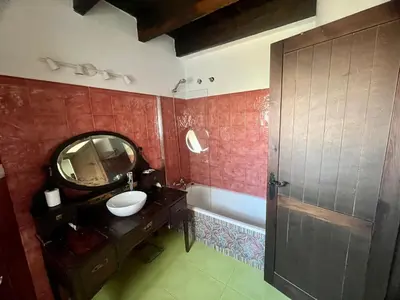 a bathroom with a sink and a mirror and a tub at Mirador Villa Perla Grupo AC Gestion in Arcos de la Frontera