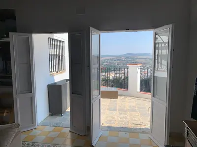 an open door to a balcony with a view at Mirador Villa Perla Grupo AC Gestion in Arcos de la Frontera