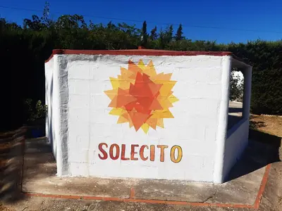 a sign for a gas station with a maple leaf on it at SOLECITO in Chiclana de la Frontera