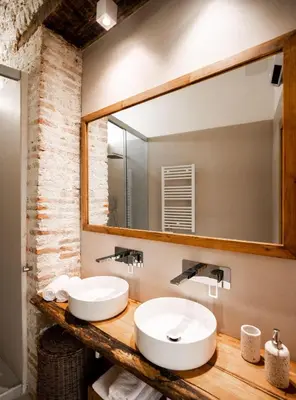 two sinks in a bathroom with a large mirror at La Posada de Juan in Cádiz