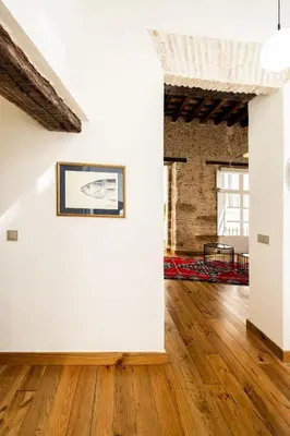 a room with a white wall and a picture on the wall at La Posada de Juan in Cádiz
