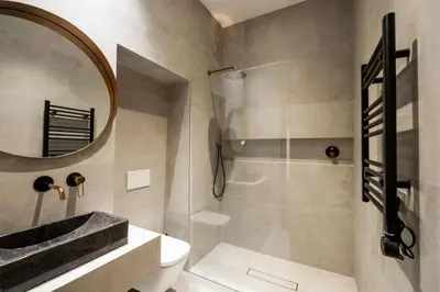 a bathroom with a sink and a toilet and a mirror at La Posada de Juan in Cádiz