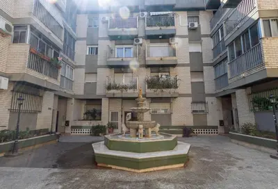 a fountain in front of an apartment building at RONDA DE MULEROS 6 in Jerez de la Frontera