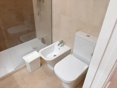 a bathroom with a white sink and a mirror at Cozy Apartment in Cádiz with Terrace in Cádiz