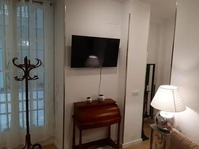 a mirror in a hallway with candles and candlesticks at Cozy Apartment in Cádiz with Terrace in Cádiz