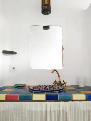 a table with a sink in a room at La Casita de Los Alambiques in Chiclana de la Frontera
