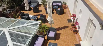 an overhead view of a patio with tables and chairs at Apartamento la Capillita in Sanlúcar de Barrameda