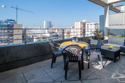 a table and chairs on a balcony with a view at Loft Space - Time in Cádiz in Cádiz