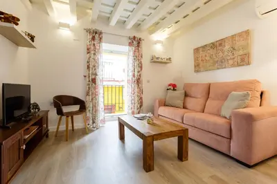 a living room with a couch and a table at Apartamentos LOTO y LIZ by Cadiz4Rentals in Cádiz