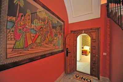 a room with a painting on the wall and a doorway at Los Corceles Casa Palacio in Jerez de la Frontera