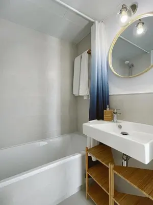 a bathroom with a sink and a tub and a mirror at Costa Ballena Terrace Beach House in Costa Ballena