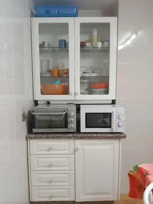 a kitchen with white cabinets and two microwaves at Beach Apartment La Costilla - Free Parking in Rota
