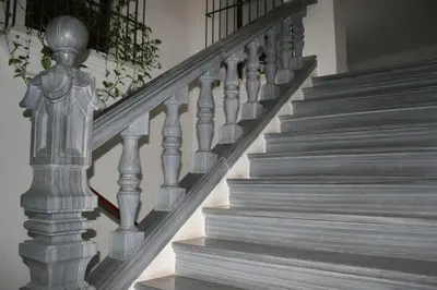 a set of stairs in a home with grey wood at CASA PALACIO LAS PALOMAS in Sanlúcar de Barrameda