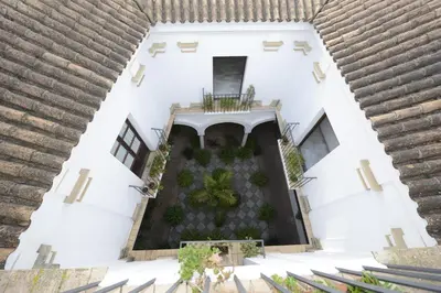 an aerial view of a white building with a courtyard at CASA PALACIO LAS PALOMAS in Sanlúcar de Barrameda